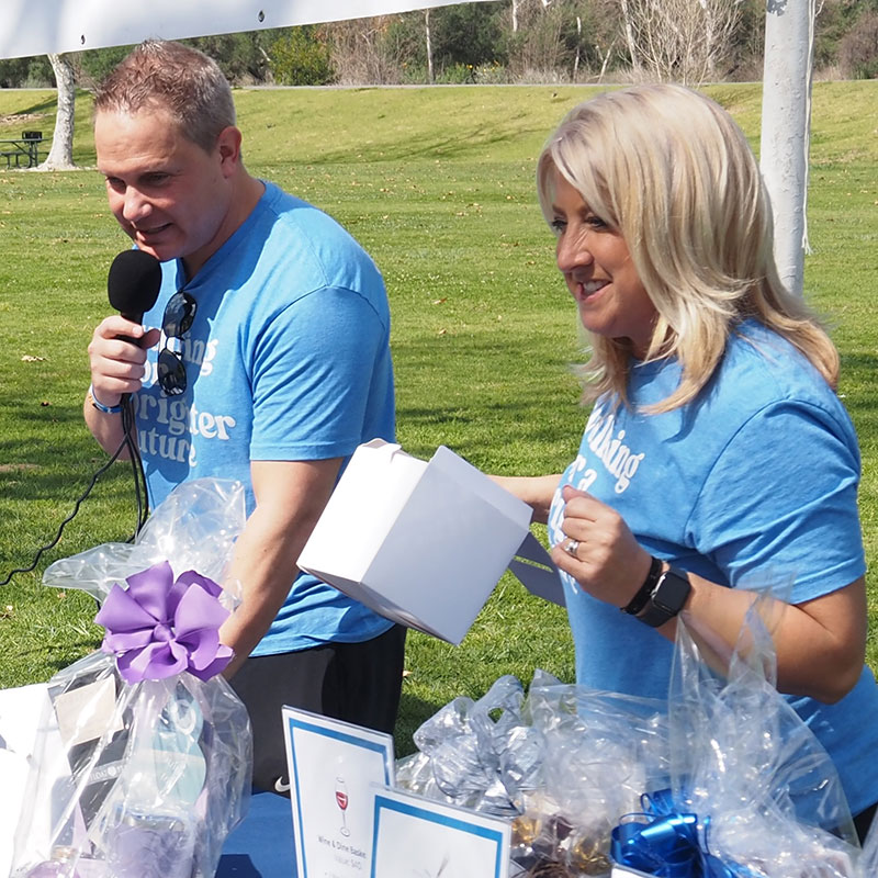 Zack and Sandi Harrison at Southern California Walk Strong to Cure JM Raffle Table