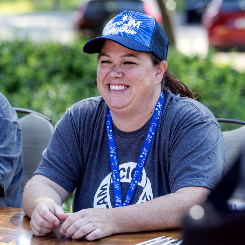 Mel Belpedio manning table at Chicago Chapter Walk Strong to Cure JM event