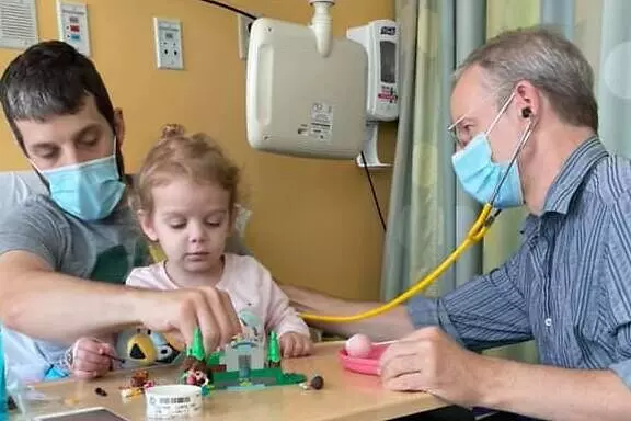 pediatrician discussing treatment plan with parents