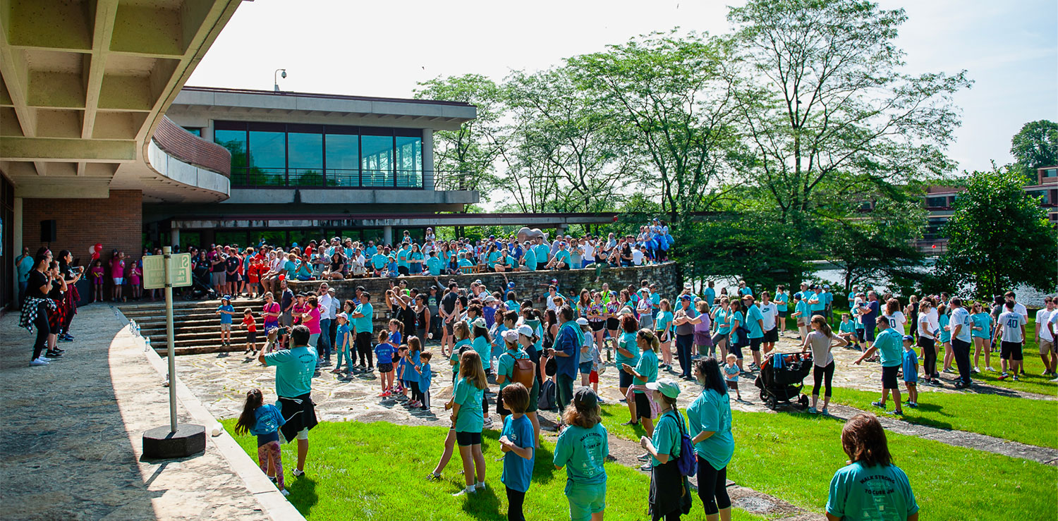 Large gathering of people attend a fundraiser to advance juvenile myositis research.